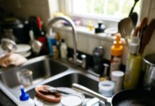 Arthritis Diet Plan: What to Eat for Joint Health Swollen hand in a chaotic kitchen mess